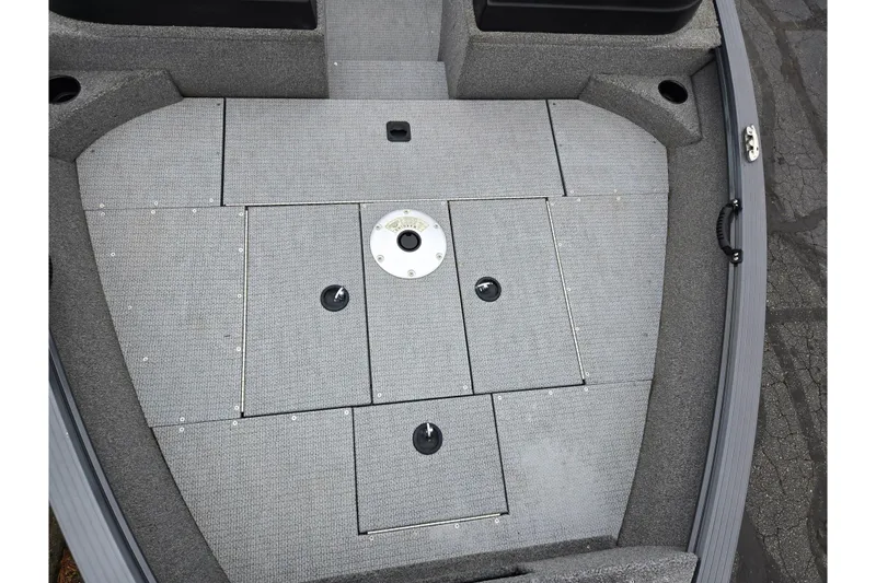 Slide: The Image of 2022 G3 Angler V164 F boat deck with storage compartments and gray carpeting. - 17