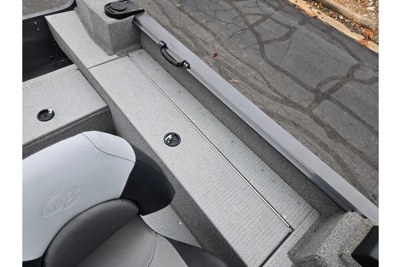 Slide: The Image of 2022 G3 Angler V164 F boat interior with gray seating and storage compartments. - 20