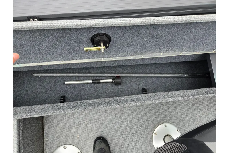 Slide: The Image of 2022 G3 Angler V164 F boat storage compartment with fishing rod holder. - 21