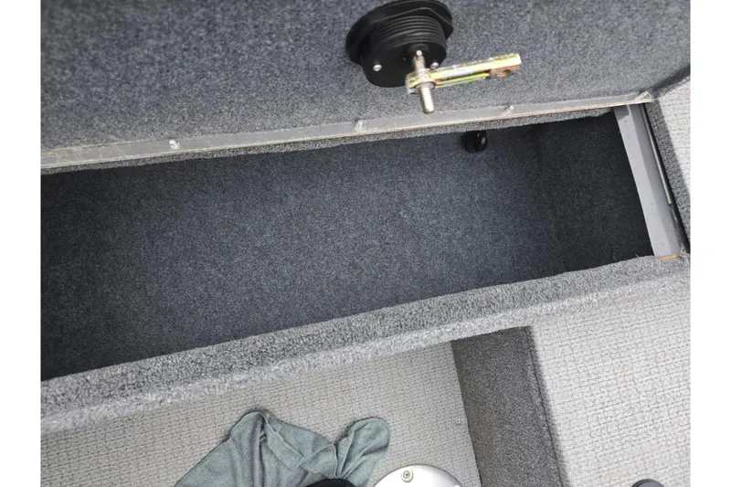 Slide: The Image of 2022 G3 Angler V164 F boat storage compartment with carpeted interior. - 22