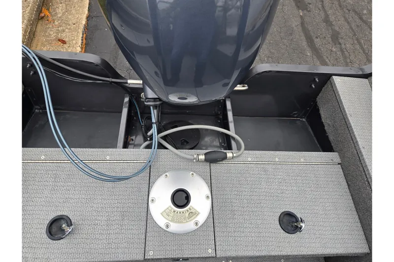 Slide: The Image of 2022 G3 Angler V164 F boat interior with motor and deck details. - 26