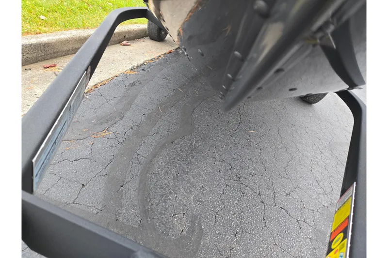 Slide: The Image of 2022 G3 Angler V164 F boat on trailer, parked on cracked asphalt. - 7