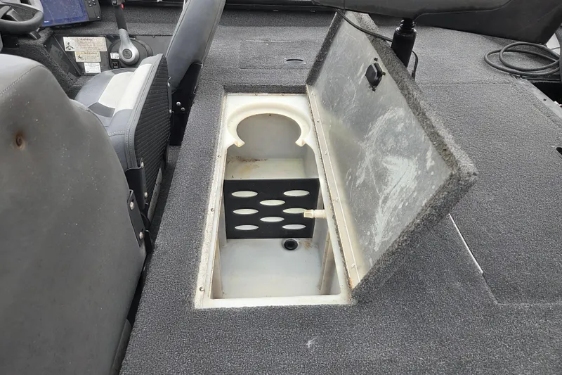 Slide: The Image of Open storage compartment in 2018 Lowe Stinger 195C boat interior. - 10