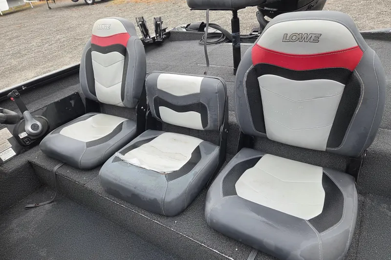 Slide: The Image of 2018 Lowe Stinger 195C boat seats, gray and red design, arranged in a row. - 15