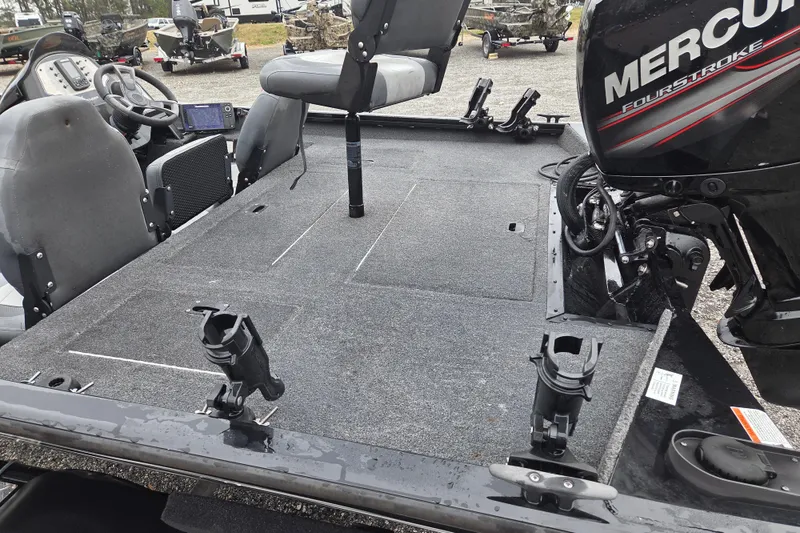 Slide: The Image of 2018 Lowe Stinger 195C fishing boat interior with Mercury FourStroke engine. - 16