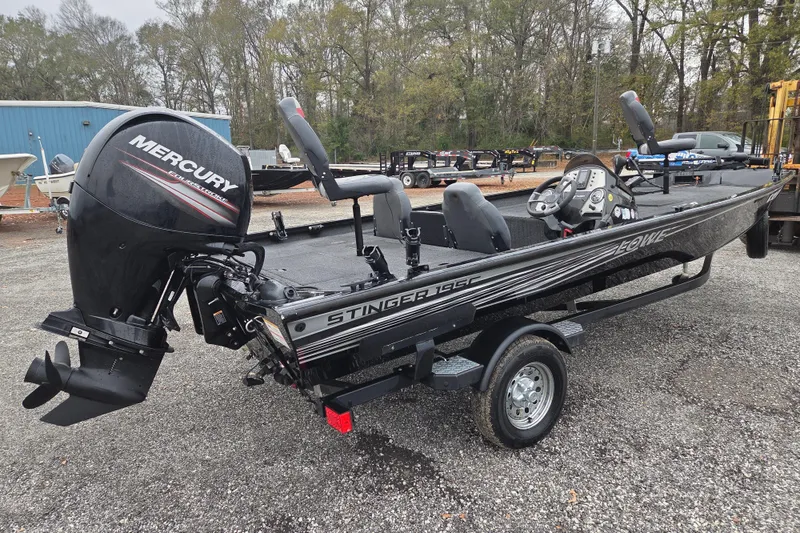 Slide: The Image of 2018 Lowe Stinger 195C fishing boat with Mercury outboard motor on trailer. - 3
