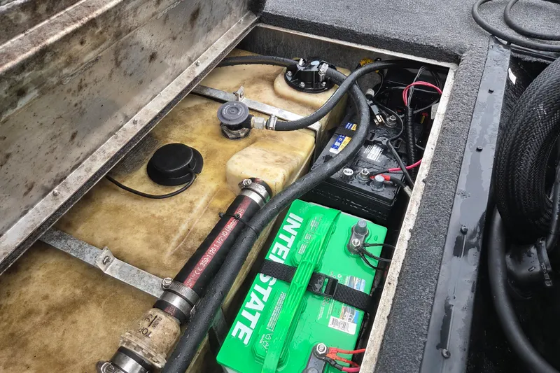 Slide: The Image of 2018 Lowe Stinger 195C boat battery and fuel tank compartment. - 9