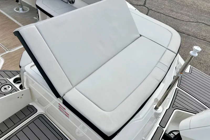 Slide: The Image of 2023 Searay SPX230 boat with cushioned seating and sleek deck design. - 15