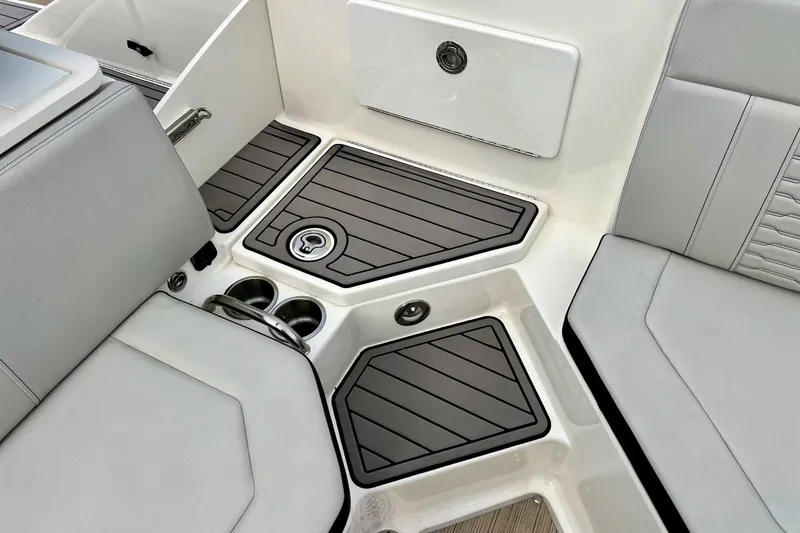 Slide: The Image of 2023 Searay SPX230 boat interior with sleek seating and modern flooring design. - 28