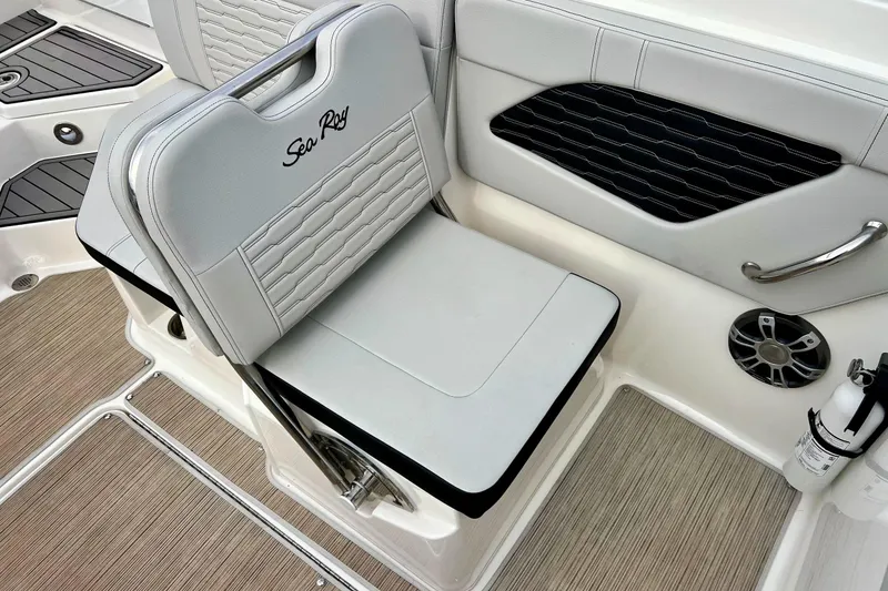 Slide: The Image of 2023 Searay SPX230 boat interior with cushioned seating and modern design elements. - 35