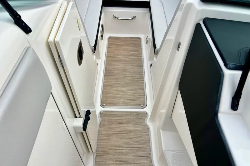 Slide: The Image of 2023 Searay SPX230 boat interior with sleek flooring and modern design. - 46