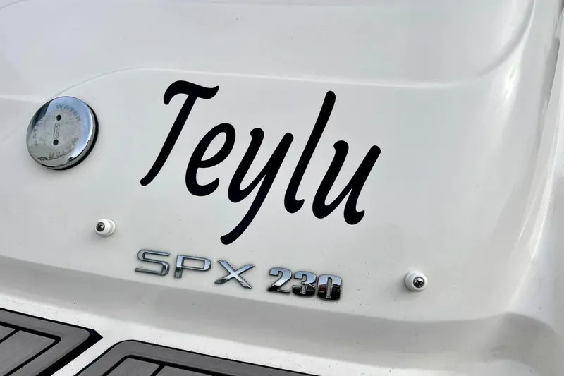 Slide: The Image of 2023 Searay SPX230 boat with "Teylu" name on the stern. - 9
