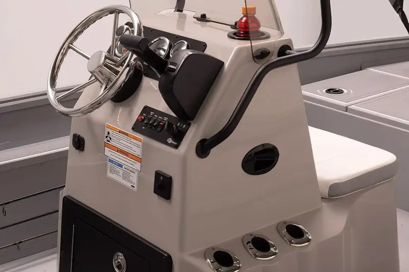 Slide: The Image of Steering console of 2026 G3 Bay 17 boat with controls and seating. - 4