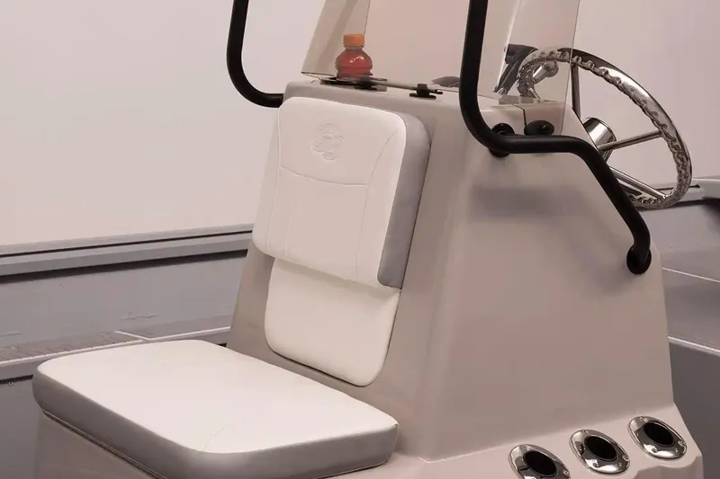 Slide: The Image of 2026 G3 Bay 17 boat console with cushioned seat and steering wheel. - 5