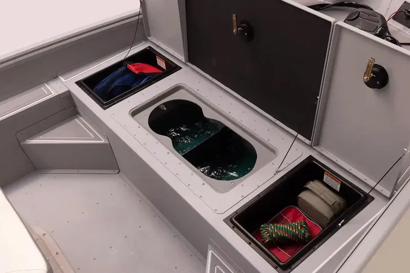 Slide: The Image of Interior storage compartments of 2026 G3 Bay 17 boat, featuring organized gear and equipment. - 6