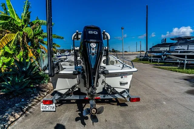 Slide: The Image of 2022 Mako SKIFF 15CC boat with outboard motor on trailer. - 4