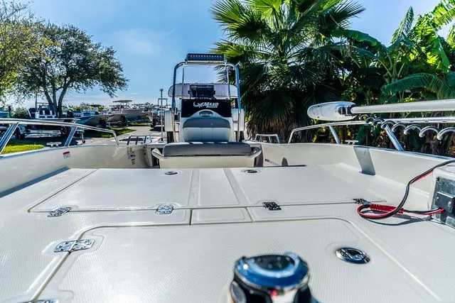 Slide: The Image of Mako SKIFF 15CC 2022 on trailer, surrounded by palm trees. - 9