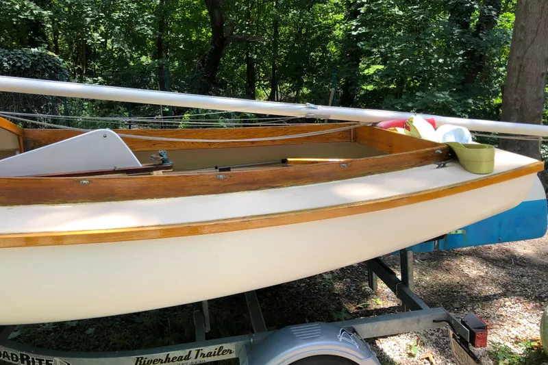 Slide: The Image of 1994 STUR DEE sailboat on trailer in wooded area. - 10