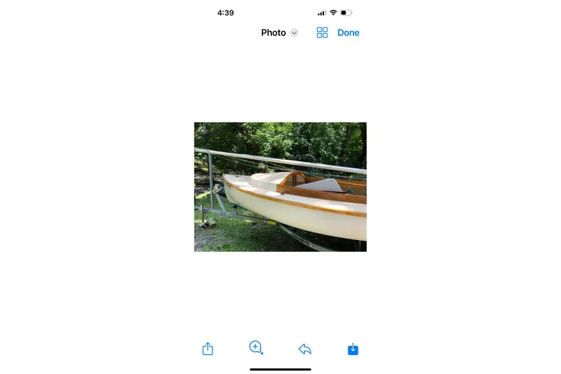 Slide: The Image of 1994 STUR DEE sailboat on trailer, surrounded by greenery. - 7