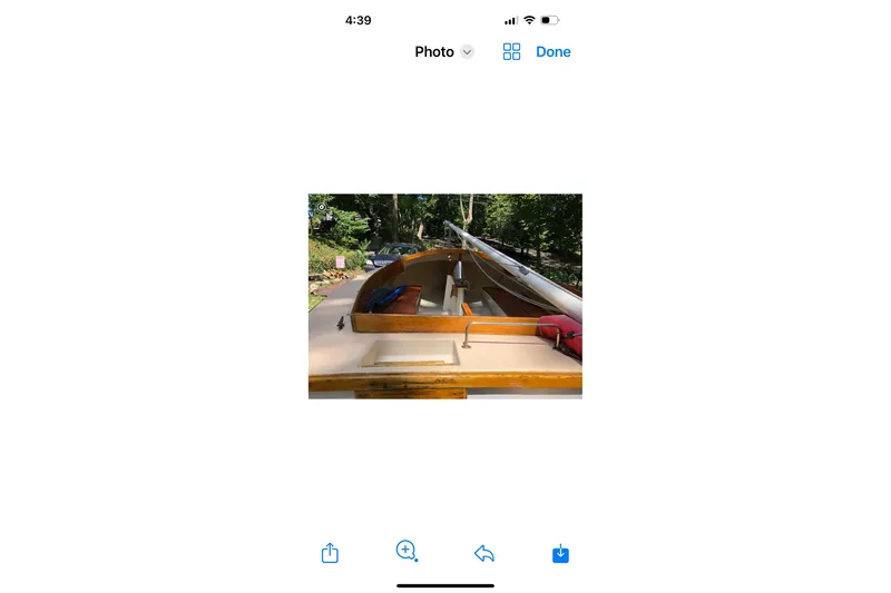 Slide: The Image of 1994 STUR DEE sailboat deck with mast and rigging, surrounded by greenery. - 9