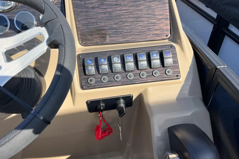 Slide: The Image of 2026 Sylvan Mirage 822 CLZ dashboard with steering wheel and control panel. - 14