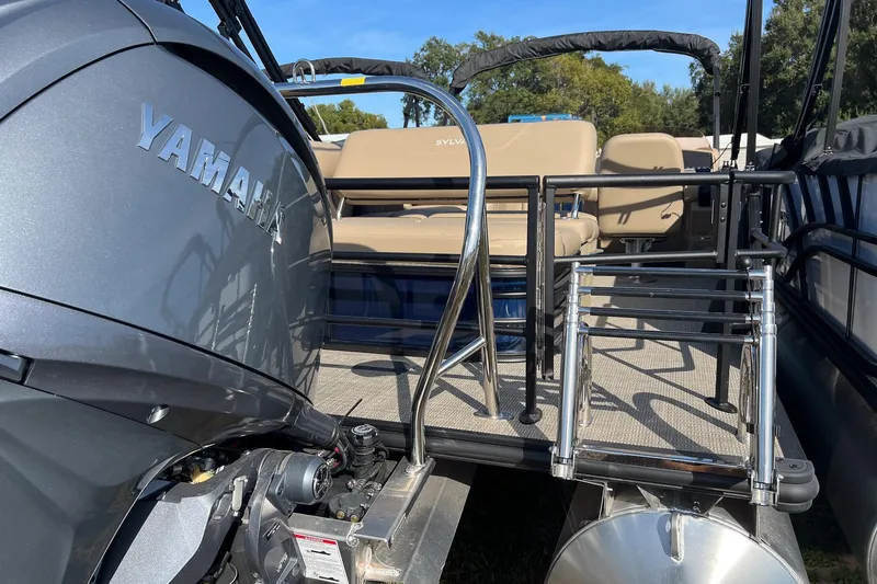 Slide: The Image of 2026 Sylvan Mirage 822 CLZ pontoon boat with Yamaha engine, featuring comfortable seating. - 2