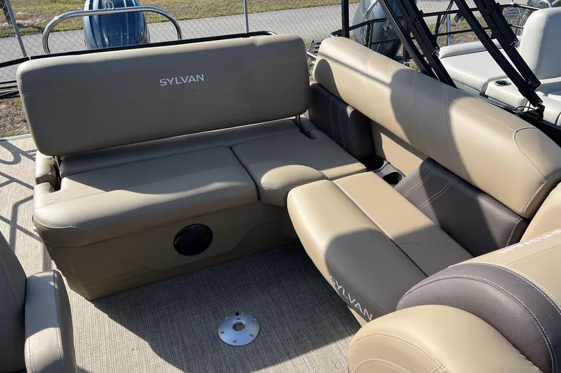 Slide: The Image of Luxurious seating on 2026 Sylvan Mirage 822 CLZ pontoon boat, featuring beige upholstery. - 9
