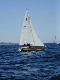 Slide: The Image of 2014 Beneteau FIRST 25 S sailboat navigating open waters. - 3
