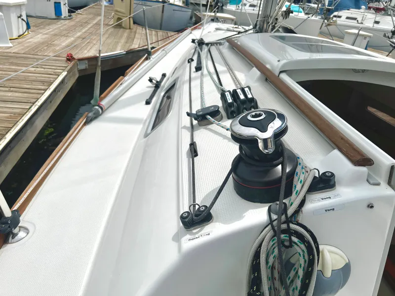 Slide: The Image of Beneteau FIRST 25 S 2014 sailboat deck with winches and ropes. - 9