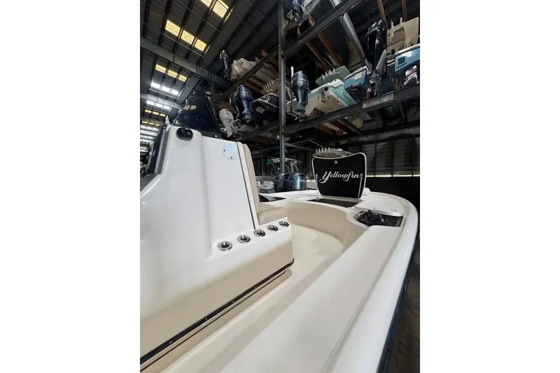 Slide: The Image of 2017 Yellowfin 24 Bay CE boat in storage, showcasing sleek design and modern features. - 14