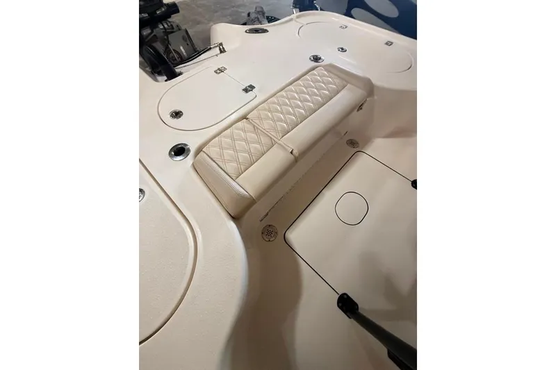 Slide: The Image of 2017 Yellowfin 24 Bay CE boat interior with quilted seating and storage compartments. - 19