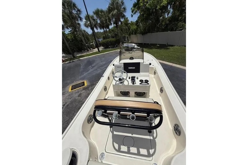 Slide: The Image of 2017 Yellowfin 24 Bay CE boat interior with steering console and Simrad display. - 4