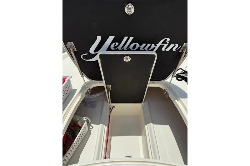 Slide: The Image of 2017 Yellowfin 24 Bay CE boat storage compartment with open hatch. - 9
