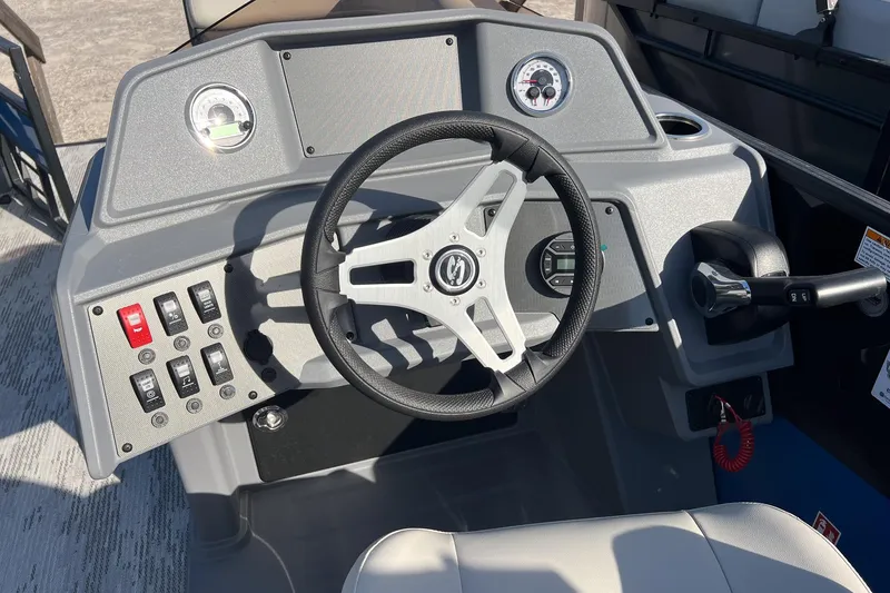 Slide: The Image of Steering console of 2026 Sylvan R22 LZ DH boat with gauges and controls. - 12