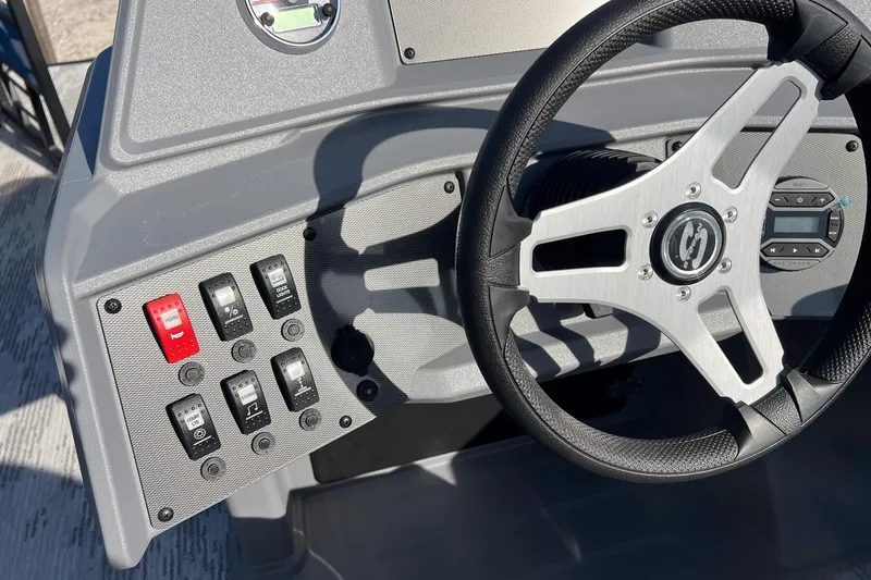 Slide: The Image of Steering wheel and control panel of 2026 Sylvan R22 LZ DH boat. - 13