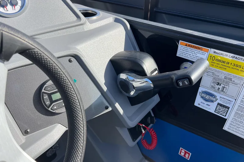 Slide: The Image of Control panel of 2026 Sylvan R22 LZ DH boat with steering wheel and throttle. - 14
