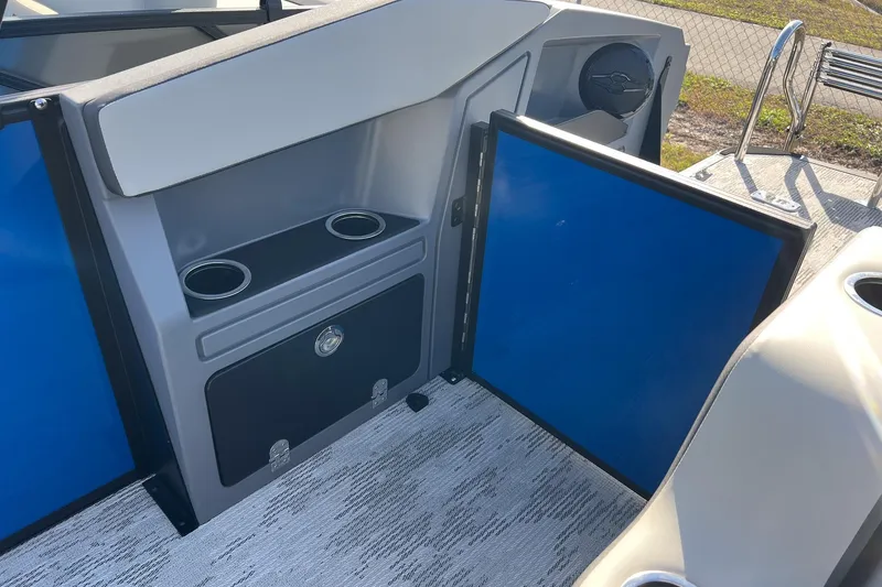 Slide: The Image of Interior of 2026 Sylvan R22 LZ DH boat with cup holders and storage compartment. - 17