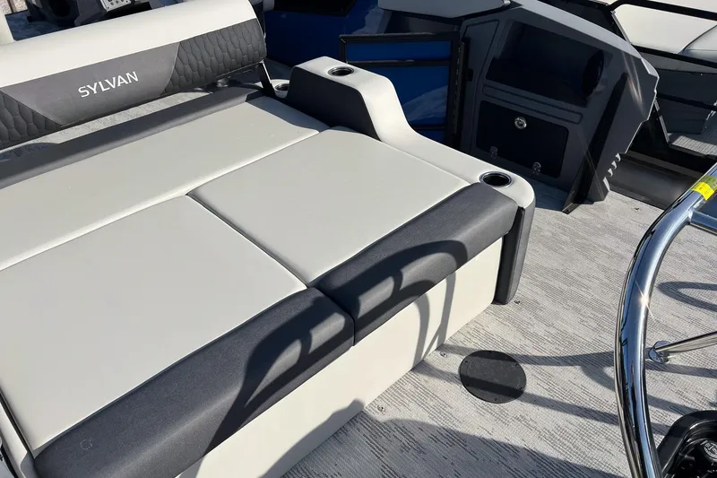 Slide: The Image of 2026 Sylvan R22 LZ DH boat interior with cushioned seating and steering wheel. - 20