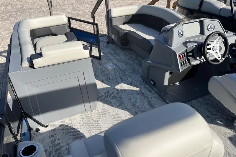 Slide: The Image of 2026 Sylvan R22 LZ DH boat interior with modern seating and steering console. - 22