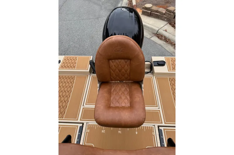 Slide: The Image of Brown leather seat on 2026 G3 Bay 21 GX boat deck. - 10