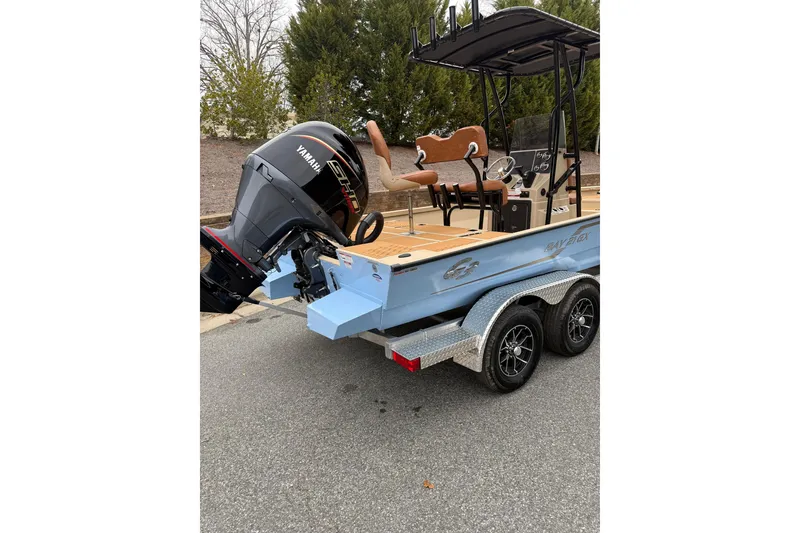 Slide: The Image of 2026 G3 Bay 21 GX boat with Yamaha engine on a trailer, parked outdoors. - 12