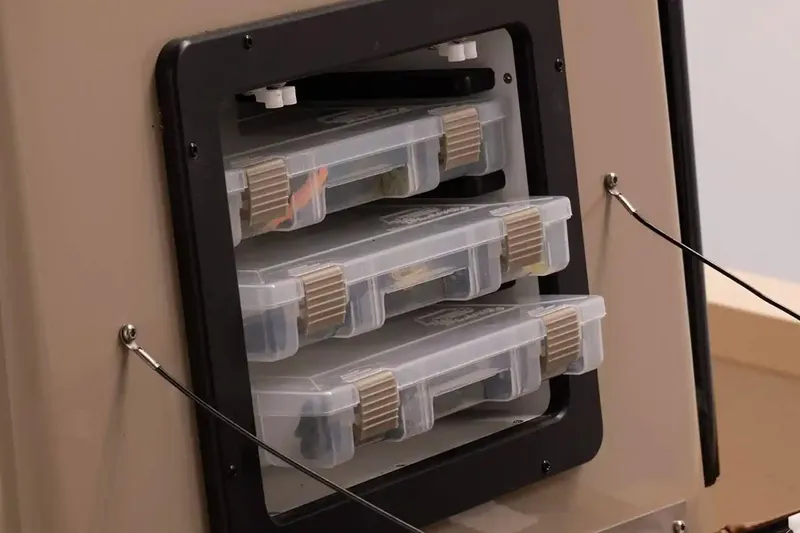 Slide: The Image of 2026 G3 Bay 21 GX boat interior with steering wheel and brown seating. - 6