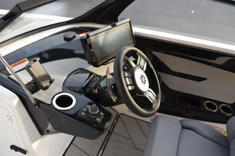 Slide: The Image of 2026 Yamaha Boats 222XD cockpit with steering wheel, touchscreen, and modern controls. - 11