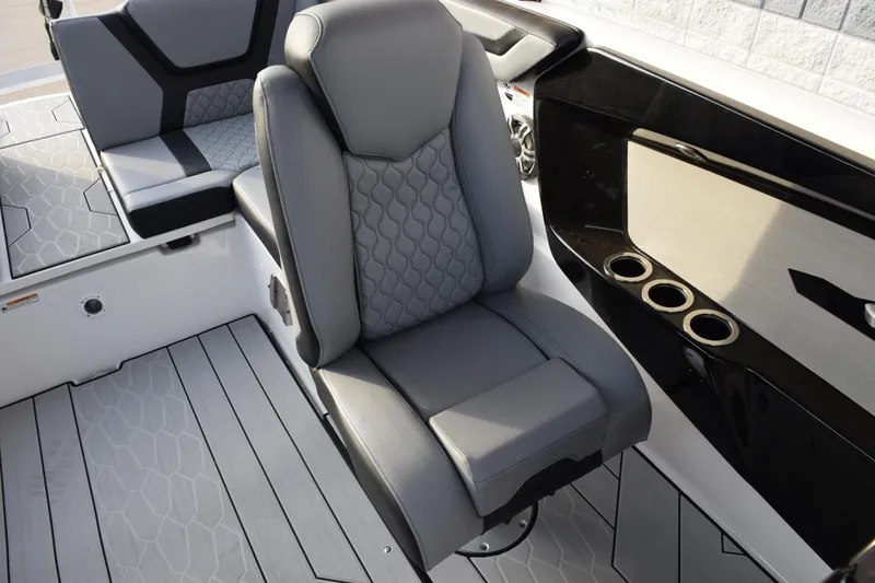 Slide: The Image of 2026 Yamaha Boats 222XD interior with gray seating and cup holders. - 15