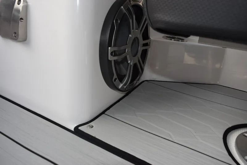 Slide: The Image of 2026 Yamaha Boats 222XD interior speaker and flooring detail. - 16