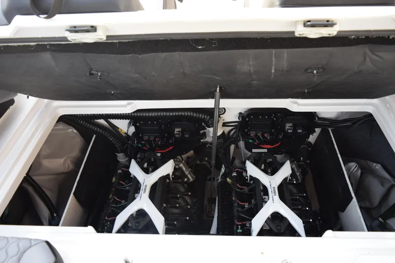 Slide: The Image of Engine compartment of 2026 Yamaha Boats 222XD, showcasing dual engines and mechanical components. - 18