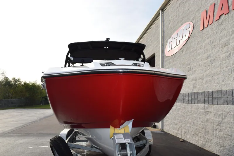 Slide: The Image of 2026 Yamaha Boats 222XD in vibrant red, displayed outside a dealership. - 3