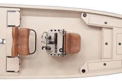 Slide: The Image of 2026 G3 Bay 21 GX boat on trailer, parked outdoors, featuring tan and brown seating. - 2