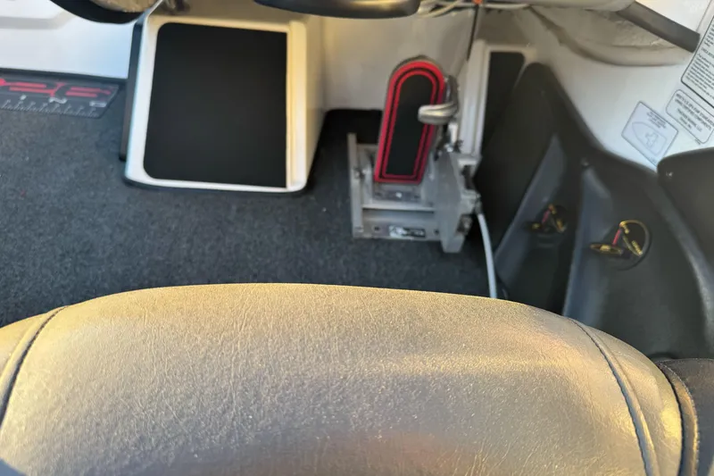 Slide: The Image of Interior view of a 2011 Nitro Z-9 DC boat, featuring steering and foot controls. - 11