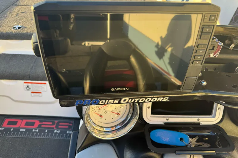 Slide: The Image of Dashboard of a 2011 Nitro Z-9 DC boat with Garmin display and speedometer. - 12